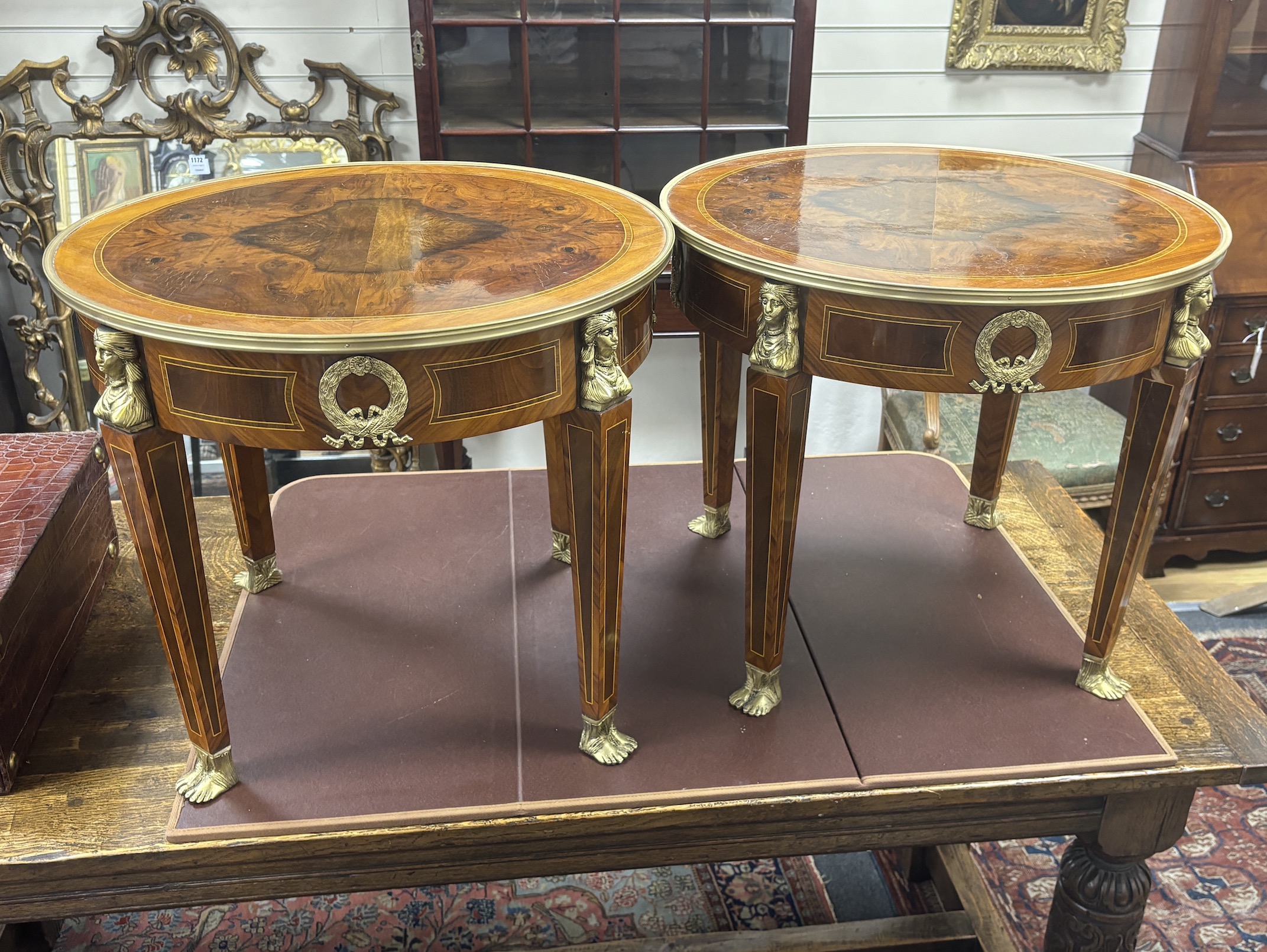 A pair of Empire style circular gilt metal mounted occasional tables, diameter 61cm, height 53cm